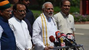 Narendra Modi stands with senior BJP leaders as he addresses media after arriving for the monsoon session of Parliament in New Delhi on Wednesday.(AFP Photo) Narendra Modi stands with senior BJP leaders as he addresses media after arriving for the monsoon session of Parliament in New Delhi on Wednesday.(AFP Photo)