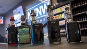 Electronic cigarette devices sit on a counter at the NXNW Vapor store in Sacramento, California, US.(David Paul Morris/Bloomberg) Electronic cigarette devices sit on a counter at the NXNW Vapor store in Sacramento, California, US.(David Paul Morris/Bloomberg)