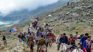 Security personnel look on as a batch of pilgrims are on their way towards the holy cave shrine of Amarnath, in Sheshnag Lake.(PTI File Photo) Security personnel look on as a batch of pilgrims are on their way towards the holy cave shrine of Amarnath, in Sheshnag Lake.(PTI File Photo)