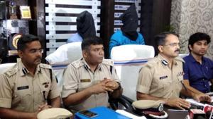 Police officials with the arrested accused in Kochang gangrape case John Junas Tudu and Balram Samad during a press conference in Khunti on Sunday.(HT Photo) Police officials with the arrested accused in Kochang gangrape case John Junas Tudu and Balram Samad during a press conference in Khunti on Sunday.(HT Photo)