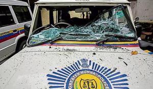 A police car vandalised by the mob on Sunday.(Kunal Patil/HT Photo) A police car vandalised by the mob on Sunday.(Kunal Patil/HT Photo)