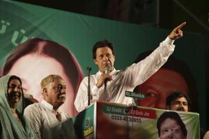 Pakistani politician Imran Khan, chief of Pakistan Tehreek-e-Insaf party, addresses his supporters during an election campaign in Lahore, Pakistan.(AP Photo)