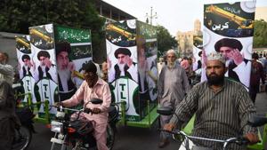 Supporters of hardline Tehreek-e-Labbaik Pakistan (TLP) ride on bikes during an election rally in Karachi. Pakistan's politicians, including PM hopeful Imran Khan, are mainstreaming extremism by invoking hardline issues such as blasphemy, analysts say.(AFP/File Photo)