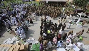 Pakistan election 2018: Polling staff gather at a distribution centre to receive voting material for elections, in Peshawar, Pakistan, Tuesday, July 24, 2018.(AP Photo) Pakistan election 2018: Polling staff gather at a distribution centre to receive voting material for elections, in Peshawar, Pakistan, Tuesday, July 24, 2018.(AP Photo)