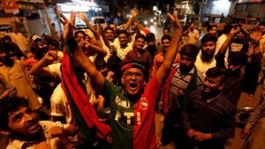 Supporters of the Pakistan Tehreek-e-Insaf (PTI) celebrate during the general election in Karachi on July 25.(REUTERS)