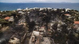 An aerial view shows burnt houses following a wildfire in the village of Mati, near Athens, .(AFP Photo) An aerial view shows burnt houses following a wildfire in the village of Mati, near Athens, .(AFP Photo)