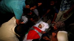 Mourners gather around the body of Palestinian boy Majdi al-Satari, who was killed by Israeli troops during a protest at the Israel-Gaza border, during his funeral in Rafah in the southern Gaza Strip July 28, 2018.(REUTERS) Mourners gather around the body of Palestinian boy Majdi al-Satari, who was killed by Israeli troops during a protest at the Israel-Gaza border, during his funeral in Rafah in the southern Gaza Strip July 28, 2018.(REUTERS)