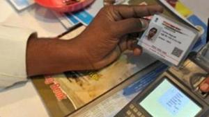 A visitor gives a thumb impression to withdraw money from his bank account with his Aadhaar or Unique Identification (UID) card during a Digi Dhan Mela, held to promote digital payment, in Hyderabad on January 18, 2017.(AFP) A visitor gives a thumb impression to withdraw money from his bank account with his Aadhaar or Unique Identification (UID) card during a Digi Dhan Mela, held to promote digital payment, in Hyderabad on January 18, 2017.(AFP)