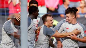 Liverpool's Xherdan Shaqiri celebrates with team mates after scoring a goal against Manchester United.(REUTERS) Liverpool's Xherdan Shaqiri celebrates with team mates after scoring a goal against Manchester United.(REUTERS)