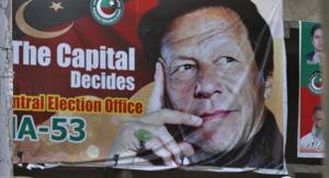 A big poster of Imran Khan, head of Pakistan Tehreek-e-Insaf party, at a market in Islamabad on July 28.(AP Photo) A big poster of Imran Khan, head of Pakistan Tehreek-e-Insaf party, at a market in Islamabad on July 28.(AP Photo)