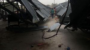 The mangled shade that caved in while hundreds of people perched on it were watching a tractor race in Shriganganagar on Sunday.(HT PHOTO) The mangled shade that caved in while hundreds of people perched on it were watching a tractor race in Shriganganagar on Sunday.(HT PHOTO)