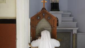 A nun in confession at Saint Mary's Basilica in Secunderabad. The National Commission for Women has recommended the abolition of the practice of confession in Catholic Churches in the country, claiming they are used for exploiting people.(AFP) A nun in confession at Saint Mary's Basilica in Secunderabad. The National Commission for Women has recommended the abolition of the practice of confession in Catholic Churches in the country, claiming they are used for exploiting people.(AFP)