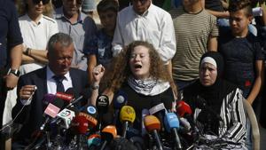 Ahed Tamimi speaks sitting between her father Bassam and mother Nariman during a press conference on the outskirts of the West Bank village of Nabi Saleh near the West Bank city of Ramallah, Sunday, July 29, 2018.(AP) Ahed Tamimi speaks sitting between her father Bassam and mother Nariman during a press conference on the outskirts of the West Bank village of Nabi Saleh near the West Bank city of Ramallah, Sunday, July 29, 2018.(AP)