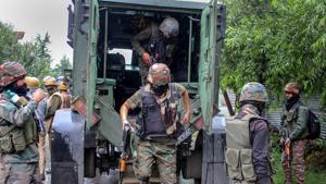 Security personnel outside a house which was held up by alleged militants during an encounter, in Pulwama district of south Kashmir on June 29.(PTI Photo) Security personnel outside a house which was held up by alleged militants during an encounter, in Pulwama district of south Kashmir on June 29.(PTI Photo)