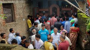 People gather outside the house where seven members of a family allegedly committed suicide, in Ranchi on Monday, July 30, 2018.(PTI) People gather outside the house where seven members of a family allegedly committed suicide, in Ranchi on Monday, July 30, 2018.(PTI)