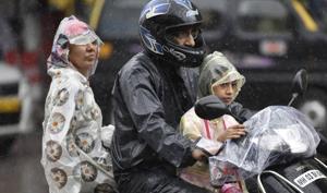 A family on a bike at CSMT with only the driver wearing a helmet.(Kunal Patil/HT Photo) A family on a bike at CSMT with only the driver wearing a helmet.(Kunal Patil/HT Photo)