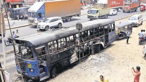 A bus burnt in Chakan after a Maratha stir turned violent on Tuesday.(HT Photo) A bus burnt in Chakan after a Maratha stir turned violent on Tuesday.(HT Photo)