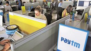 Employees work at their desks at the One97 Communications Ltd. headquarters in Noida, Uttar Pradesh, India, on Thursday, May 14, 2015. One97, which operates PayTM, think they have an edge as the country is now in the midst of a smartphone boom, and younger Indians are shunning branches and turning to apps for their banking needs, mirroring global trends. Photographer: Kuni Takahashi/Bloomberg(Bloomberg) Employees work at their desks at the One97 Communications Ltd. headquarters in Noida, Uttar Pradesh, India, on Thursday, May 14, 2015. One97, which operates PayTM, think they have an edge as the country is now in the midst of a smartphone boom, and younger Indians are shunning branches and turning to apps for their banking needs, mirroring global trends. Photographer: Kuni Takahashi/Bloomberg(Bloomberg)
