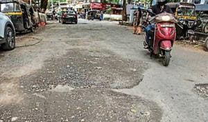 An unrepaired road in Bandra, on Wednesday.(Satish Bate/HT)