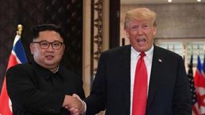 (FILES) In this file photo taken on June 12, 2018 US President Donald Trump (R) and North Korea's leader Kim Jong Un shake hands following a signing ceremony during their historic US-North Korea summit, at the Capella Hotel on Sentosa island in Singapore. P(AFP) (FILES) In this file photo taken on June 12, 2018 US President Donald Trump (R) and North Korea's leader Kim Jong Un shake hands following a signing ceremony during their historic US-North Korea summit, at the Capella Hotel on Sentosa island in Singapore. P(AFP)