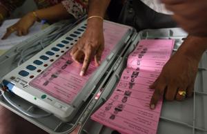 A polling staff tallies the candidates’ names on the Electronic Voting Machines (EVM) during Karnataka elections, in Bengaluru, May 11, 2018. While many developed countries are studying India’s electronic voting system, many parties in India want to go back to the paper ballot.(Arijit Sen/HT Photo) A polling staff tallies the candidates’ names on the Electronic Voting Machines (EVM) during Karnataka elections, in Bengaluru, May 11, 2018. While many developed countries are studying India’s electronic voting system, many parties in India want to go back to the paper ballot.(Arijit Sen/HT Photo)