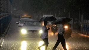 Pedestrians walk across a road during monsoon rainfall, in Kolkata on Friday, Aug 3, 2018. ((PTI) Pedestrians walk across a road during monsoon rainfall, in Kolkata on Friday, Aug 3, 2018. ((PTI)