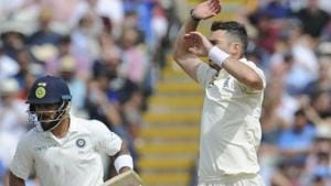 England's James Anderson reacts after bowling, as Indian cricket captain Virat Kohli takes a run during the Test cricket match between England and India at Edgbaston.(AP)