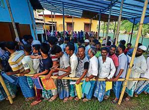 People wait in queue to check their names on the draft list at the National Register of Citizens (NRC) centre at a village in Nagaon district in Assam. The Uttarakhand BJP wants an NRC in the state to check entry of infiltrators.(Reuters File Photo For Representation) People wait in queue to check their names on the draft list at the National Register of Citizens (NRC) centre at a village in Nagaon district in Assam. The Uttarakhand BJP wants an NRC in the state to check entry of infiltrators.(Reuters File Photo For Representation)
