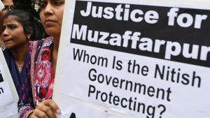 Activists hold placards as they take part in a protest over the sexual assault of girls at a state-run home in Bihar, near Bihar Bhawan in New Delhi on July 30.(AFP Photo) Activists hold placards as they take part in a protest over the sexual assault of girls at a state-run home in Bihar, near Bihar Bhawan in New Delhi on July 30.(AFP Photo)