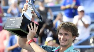 Alexander Zverev, of Germany, poses with the trophy after he defeated Alex de Minaur, of Australia, in the men's finals in the Citi Open tennis tournament.(AP) Alexander Zverev, of Germany, poses with the trophy after he defeated Alex de Minaur, of Australia, in the men's finals in the Citi Open tennis tournament.(AP)