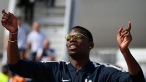 France's midfielder Paul Pogba celebrates with teammates after disembarking from the plane upon their arrival at the Roissy-Charles de Gaulle airport on the outskirts of Paris.(AFP) France's midfielder Paul Pogba celebrates with teammates after disembarking from the plane upon their arrival at the Roissy-Charles de Gaulle airport on the outskirts of Paris.(AFP)