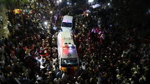 DMK party supporters gather around the ambulence carrying the body of party president M Karunanidhi.(AFP Photo) DMK party supporters gather around the ambulence carrying the body of party president M Karunanidhi.(AFP Photo)
