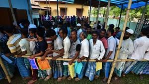 People wait in queue to check their names on the draft list at the National Register of Citizens (NRC) centre at a village in Nagaon district, Assam.(Reuters Photo) People wait in queue to check their names on the draft list at the National Register of Citizens (NRC) centre at a village in Nagaon district, Assam.(Reuters Photo)