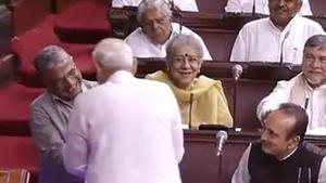 Prime Minister Narendra Modi congratulates NDA candidate Harivansh Narayan Singh who was elected as Rajya Sabha deputy chairman on Thursday.(ANI Photo/Twitter)