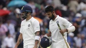 India's batsmen captain Virat Kohli, left, and India's Cheteshwar Pujara leave the pitch as rain stops play during the second day of the second test match between England and India at Lord's cricket ground in London.(AP) India's batsmen captain Virat Kohli, left, and India's Cheteshwar Pujara leave the pitch as rain stops play during the second day of the second test match between England and India at Lord's cricket ground in London.(AP)