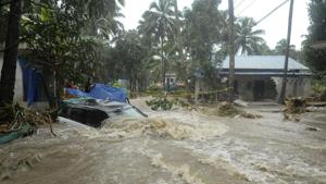 A car is submerged as roads and houses are engulfed in water following heavy rain and landslide in Kozhikode.(AP Photo) A car is submerged as roads and houses are engulfed in water following heavy rain and landslide in Kozhikode.(AP Photo)
