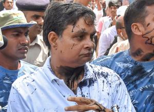 Brajesh Thakur, main accused in the Muzaffarpur shelter home case , after a woman allegedly threw ink on his face while he was being taken to a special POCSO court, in Muzaffarpur, August 8(PTI) Brajesh Thakur, main accused in the Muzaffarpur shelter home case , after a woman allegedly threw ink on his face while he was being taken to a special POCSO court, in Muzaffarpur, August 8(PTI)
