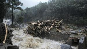 Water gushes out following heavy rain and landslide in Kozhikode, Kerala.(AP Photo) Water gushes out following heavy rain and landslide in Kozhikode, Kerala.(AP Photo)