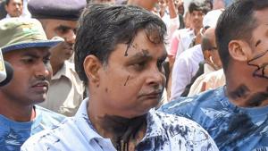 Brajesh Thakur, main accused in the Muzaffarpur shelter home case , after a woman allegedly threw ink on his face while he was being taken to a special POCSO court, in Muzaffarpur on August 8, 2018.(PTI PHOTO) Brajesh Thakur, main accused in the Muzaffarpur shelter home case , after a woman allegedly threw ink on his face while he was being taken to a special POCSO court, in Muzaffarpur on August 8, 2018.(PTI PHOTO)