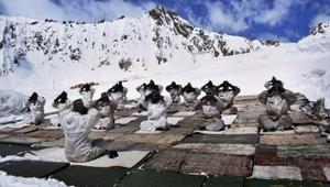 Army jawans perform yoga in Siachen. The Siachen Glacier in the Karakorum range is known as the highest militarised zone in the world where the soldiers have to battle frostbite and high winds.(PTI) Army jawans perform yoga in Siachen. The Siachen Glacier in the Karakorum range is known as the highest militarised zone in the world where the soldiers have to battle frostbite and high winds.(PTI)