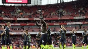 Manchester City players celebrate at the end of the English Premier League soccer match between Arsenal and Manchester City at the Emirates stadium in London.(AP)