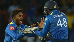 Sri Lanka's Akila Dananjaya (L) celebrates with his teammate Niroshan Dickwella during the ODI match against South Africa.(AFP) Sri Lanka's Akila Dananjaya (L) celebrates with his teammate Niroshan Dickwella during the ODI match against South Africa.(AFP)