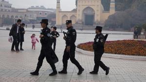 Uyghur security personnel patrol near the Id Kah Mosque in Kashgar in western China's Xinjiang region on November 4, 2017.(AP Photo) Uyghur security personnel patrol near the Id Kah Mosque in Kashgar in western China's Xinjiang region on November 4, 2017.(AP Photo)