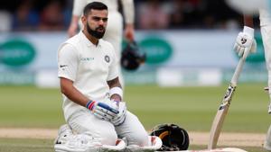 Virat Kohli reacts before receiving treatment from medical staff for a back injury.(Reuters) Virat Kohli reacts before receiving treatment from medical staff for a back injury.(Reuters)