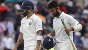 Virat Kohli, left, and Cheteshwar Pujara leave the pitch as rain stops play during the Lord’s Test against England.(AP) Virat Kohli, left, and Cheteshwar Pujara leave the pitch as rain stops play during the Lord’s Test against England.(AP)