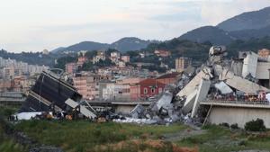 Rescuers inspect the rubble and wreckages by the Morandi motorway bridge after a section collapsed earlier in Genoa on August 14 - About 30 people were killed when a giant motorway bridge collapsed in heavy rain in the Italian city of Genoa in what the government called an Rescuers inspect the rubble and wreckages by the Morandi motorway bridge after a section collapsed earlier in Genoa on August 14 - About 30 people were killed when a giant motorway bridge collapsed in heavy rain in the Italian city of Genoa in what the government called an