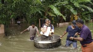 An elderly woman is rescued in a cooking utensil after her home was flooded in Thrissur, Kerala.(AP Photo) An elderly woman is rescued in a cooking utensil after her home was flooded in Thrissur, Kerala.(AP Photo)