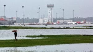 A man walks inside the flooded Cochin international airport.(REUTERS)