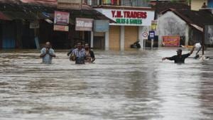 People wade through the flood waters to their marooned houses at Panadala, in district Pathanamthitta of Kerala on August 18.(Raj K Raj/HT PHOTO) People wade through the flood waters to their marooned houses at Panadala, in district Pathanamthitta of Kerala on August 18.(Raj K Raj/HT PHOTO)