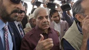 Pakistani opposition leader Shahbaz Sharif, center, arrives at the National Assembly in Islamabad, Pakistan, Friday.(AP Photo) Pakistani opposition leader Shahbaz Sharif, center, arrives at the National Assembly in Islamabad, Pakistan, Friday.(AP Photo)